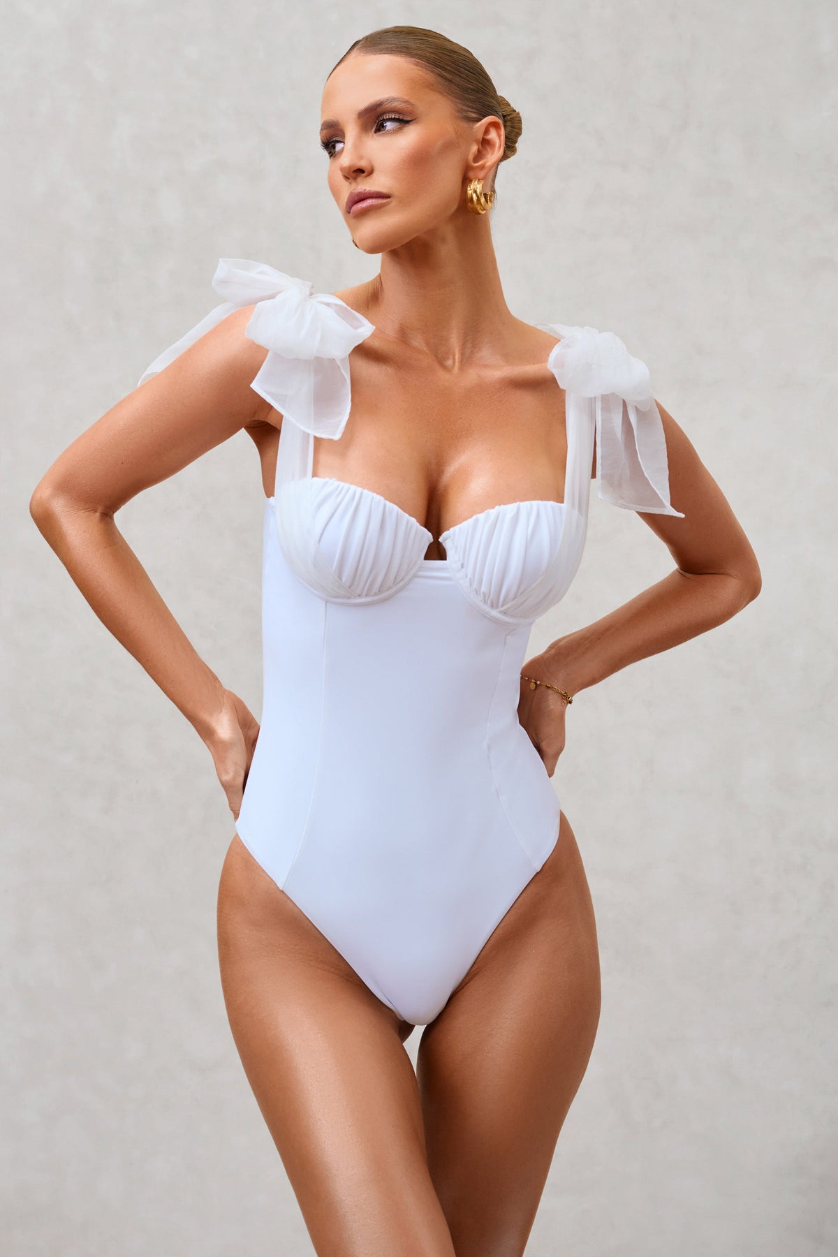 White asymmetric sculpting swimsuit